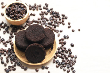 Coffee ground and Coffee beans on wooden background, Beauty and healthy care concept