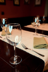 Empty glasses in restaurant, black and white photo