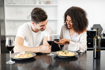 Beautiful young multiethnic couple having a romantic dinner