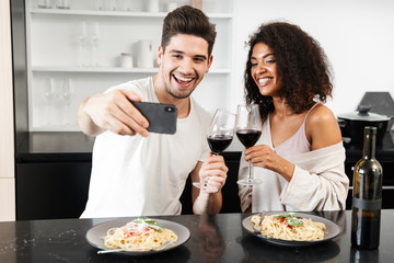 Beautiful young multiethnic couple having a romantic dinner