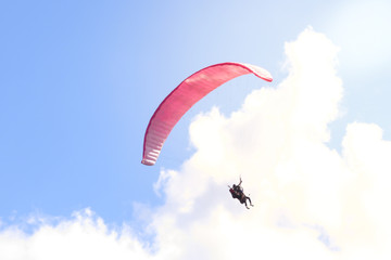 Paraglider floating in the air against the sky. Close-up / Parachute close-up