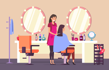 Hairdresser at beauty salon doing female haircut