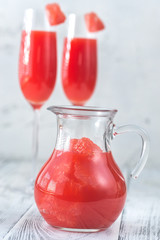 Jug of Mimosa cocktail with grapefruit slices