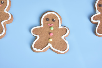 Christmas gingerbread cookies isolated on light blue pastel background