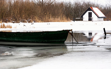Angler boat on river Zala in witertime, Hungary