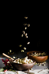 beans in clay basil on a table with ingredients for preparation