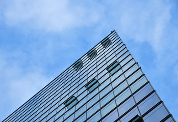 Fototapeta na wymiar Background texture of business building over sky
