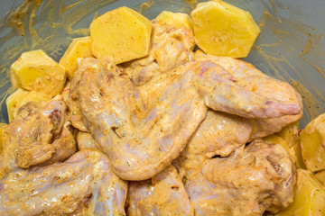 Marinated chicken wings with potatoes