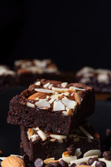 chocolate brownies with almond topping; selective focus