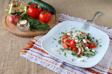 Fresh tomato salad with herbs and cheese.