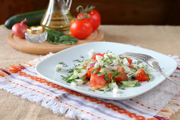 Fresh tomato salad with herbs and cheese.