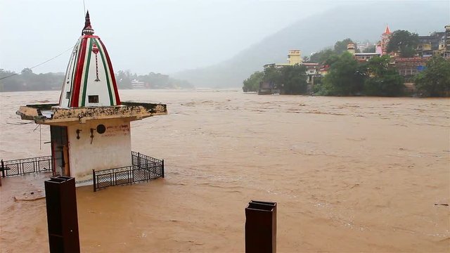 View of Rishikesh in India and the Ganges river in rainy season