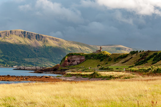 Western coast of County Antrim, Northern Ireland, UK, with the ruin of medieval Red Bay Castle, cliffs near Glenariff, Watrerfoot and Cushendall at coast road A2, a.k.a. Causeway Coastal Route
