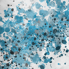 Blue paint splatter effect texture on white paper background. Artistic backdrop. Different paint drops.