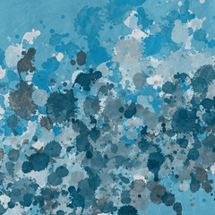 Blue paint splatter effect texture on white paper background. Artistic backdrop. Different paint drops.