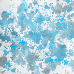 Blue paint splatter effect texture on white paper background. Artistic backdrop. Different paint drops.
