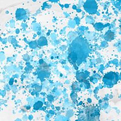 Blue paint splatter effect texture on white paper background. Artistic backdrop. Different paint drops.