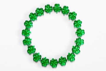 Glass shamrocks in circle frame with copy space