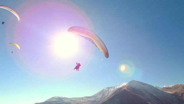 Paragliding - Caucasus Mountains, Friendship Monument, Caucasia, Gudauri, Georgia, Europe / Asia.