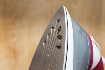 dirty ironing system with clogged steam holes.