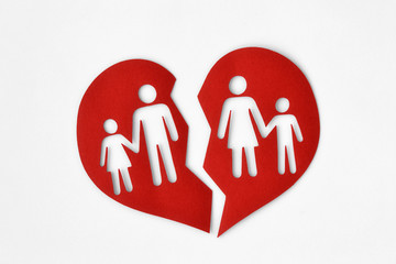 Paper broken heart with a family - Divorce and broken family concept