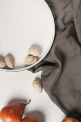 Pears and nuts on a wooden table