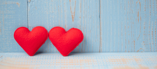 red couple heart shape decoration on blue wooden table background. Wedding, Romantic and Happy Valentine’ s day holiday concept