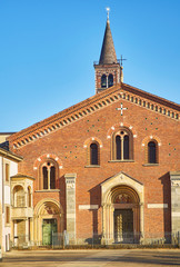 Obraz premium Main facade of the Basilica of Saint Eustorgio. View from Piazza Sant'Eustorgio square. Milan, Lombardy, Italy.