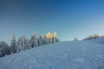 Fantastic winter mountain landscape glowing by sunlight