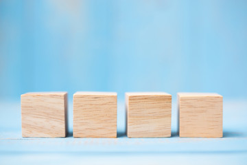 wooden cubes on blue table background with copy space for text. Business, Mission, Core Value and Solution concept