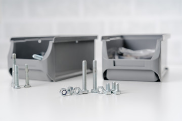 metal screw, bolt and nuts on white background.