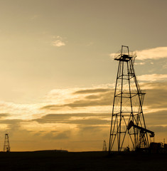silhouette of oil rig at sunset the sun