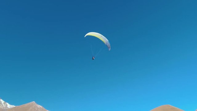 Paragliding - Caucasus Mountains, Friendship Monument, Caucasia, Gudauri, Georgia, Europe / Asia.