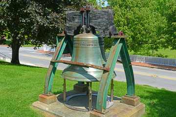 Liberty Bell in front of Maine State House. This building is the state capitol of the State of...