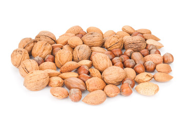 Different kind of nuts close up isolated on white background