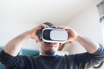 young man using virtual reality headset