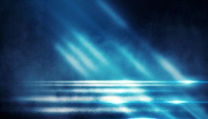 Background of empty dark room with rays of light. Concrete floor with light reflection. Smoke, neon blue light