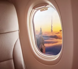 Fototapeten Airplane interior with window view of Dubai city © Jag_cz