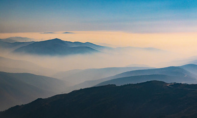 Fototapeta na wymiar Wonderfull landscape with silhouettes of mountains.
