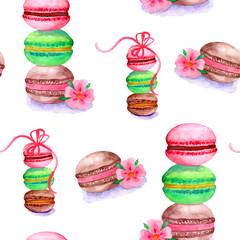 Seamless pattern. Colorful watercolor macaroons with flowers and bows isolated on a white background. Hand drawn illustration