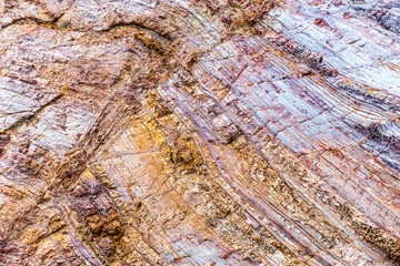 Rock layers colorful background with fascinating texture.