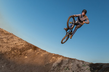 BMX Bike jump over a dirt trail