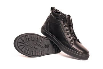 Leather black winter boots for men with lacing and lock on the thick sole, on a white background comfortable and warm in the cold season, waterproof