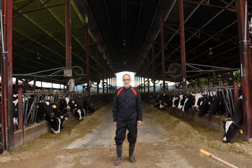 portrait of a farmer with cows