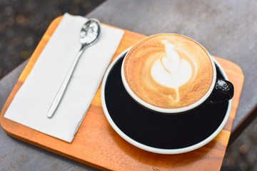 Close-Up View of a Cup of Hot Coffee with Latte Art
