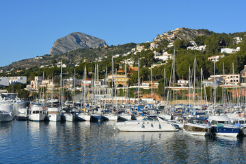 Fototapeta na wymiar boats in harbor with Montgo mountain in the background, Javea, Alicante Province, Spain