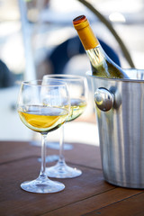 Pair of wineglasses against the yacht