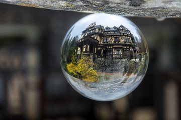 Creative ball photography with Pelisor Castle in Sinaia resort, Prahova valley, Romania