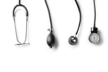 Stethoscope and sphygmomanometer on white background. Health care concept