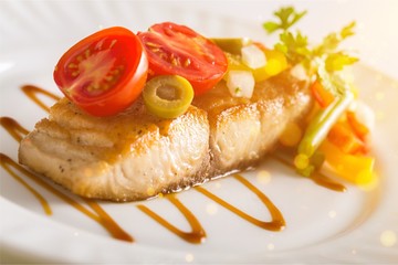 Tasty salmon on plate isolated